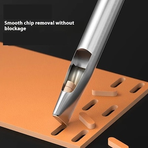 May include: A metal hole punch tool cutting through orange leather. The tool has a hollow barrel and is removing small, rectangular leather pieces. Text in the image reads "Smooth chip removal without blockage."