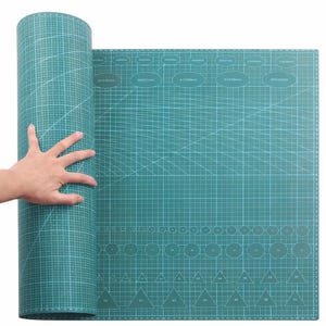May include: A rolled-up teal cutting mat with a grid pattern and various shapes and sizes printed on the surface. The mat is unrolled to reveal a larger surface with measurements in millimeters.