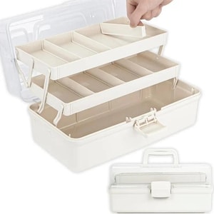 May include: A white plastic storage box with a clear lid and a multi-tiered cantilever tray system. The interior features several compartments for organisation, and the exterior includes a sturdy handle and a secure latch mechanism for closure.