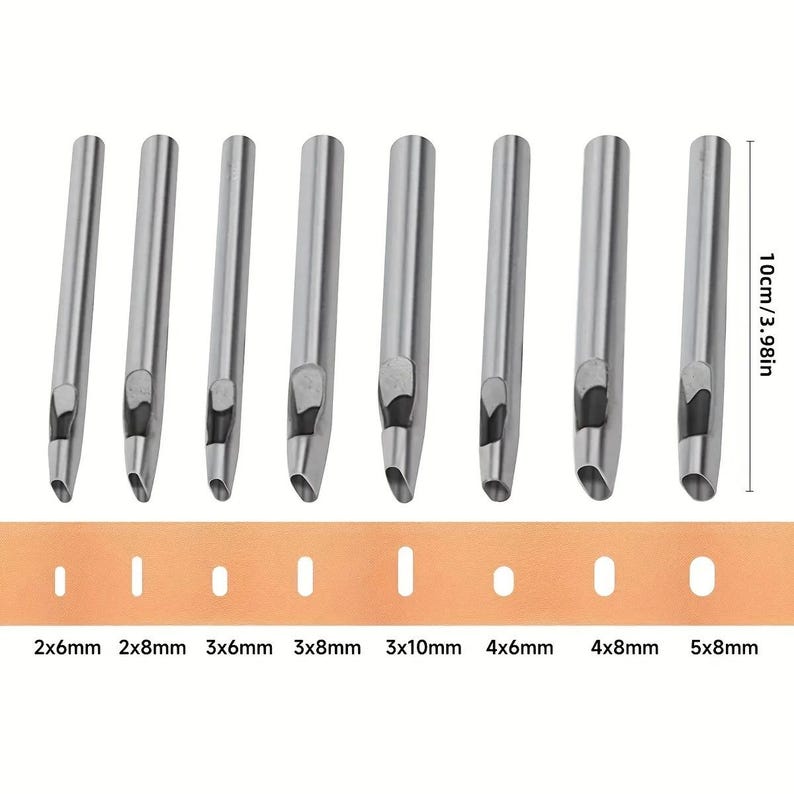 May include: A set of eight silver-colored leather craft punches with various sizes, including 2x6mm, 2x8mm, 3x6mm, 3x8mm, 3x10mm, 4x6mm, 4x8mm, and 5x8mm. A tan leather strip displays the punched hole sizes. The punches are approximately 3.98 inches (10cm) in length.