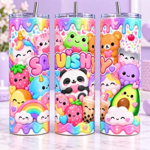 May include: Three cylindrical tumblers with lids and straws, featuring a colorful pattern of cartoon animals, fruits, and sweets. The design includes a unicorn, panda, frog, strawberry, avocado, and the word SQUISHY in large, bubble-style letters.