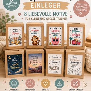 May include: Eight rectangular wooden money boxes with clear front panels, each featuring a unique illustrated insert with German text. The designs include mice, a monkey, a pig, a suitcase, a night sky, a coffee cup, rings, and a family.