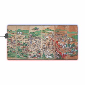 May include: A rectangular mouse mat with a historical Japanese battle scene across multiple panels. The artwork shows a detailed landscape with many figures, mountains, and trees. The mat has a black power adapter and a glowing red and blue border.