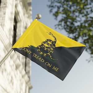 May include: A yellow and black flag featuring a coiled snake and the text "DON'T TREAD ON ME." The flag is split diagonally, with yellow above and black below. The snake is depicted in yellow and black.