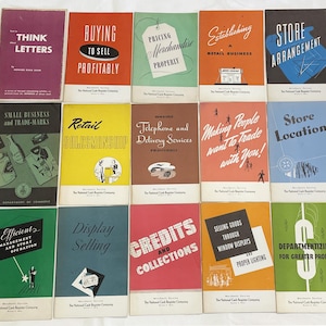 May include: A collection of vintage booklets with titles such as "Think Letters," "Buying to Sell Profitably," and "Store Arrangement." The booklets have colorful covers with text and illustrations, likely related to business and retail.