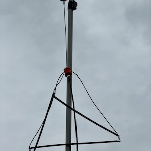 2m antenna deployed and hanging from a mast.
