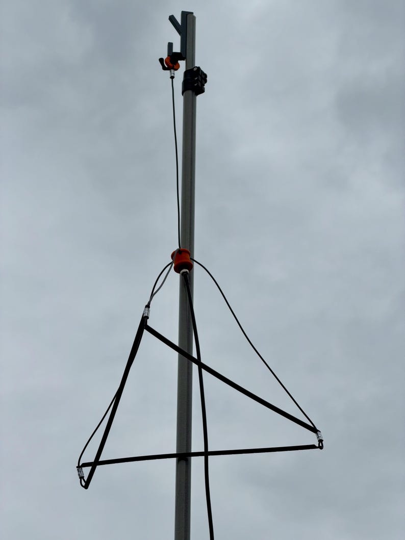 2m antenna deployed and hanging from a mast.