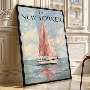 May include: A framed print of a New Yorker magazine cover dated July 1, 1974, featuring an oil painting style illustration of a sailboat with a pink sail on blue water under a cloudy sky, with the text THE NEW YORKER and PRICE $0.25 visible.