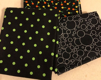 3 different dotted fabrics Black and White Dots Moda, Orange, yellow dots Clothworkds, Color Scapes SSI Studio