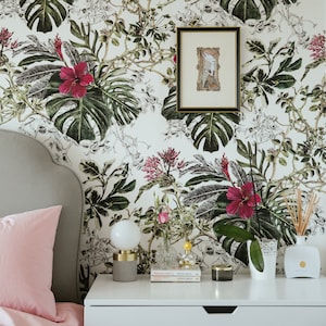 Tropical leaves botanical wallpaper behind bed