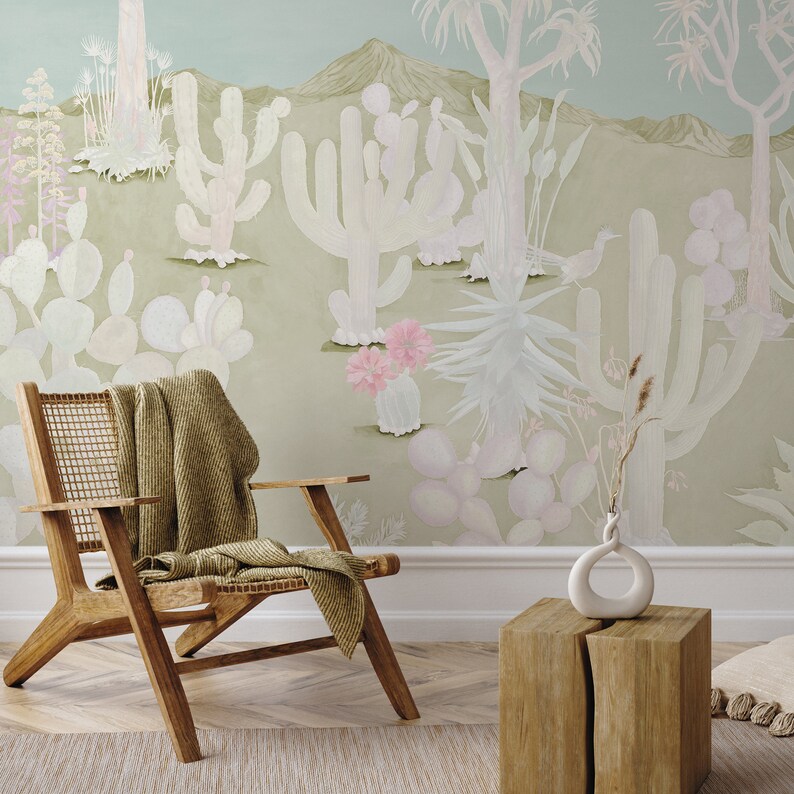 Green desert themed wallpaper behind lounge chair