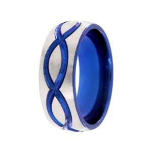 May include: A silver ring with a blue inlay design. The ring has a brushed finish and a blue band.