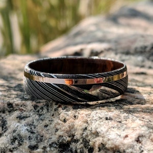 Damascus Steel Wedding Ring with 14k Solid Rose Gold Inlay and Arizona Ironwood Sleeve