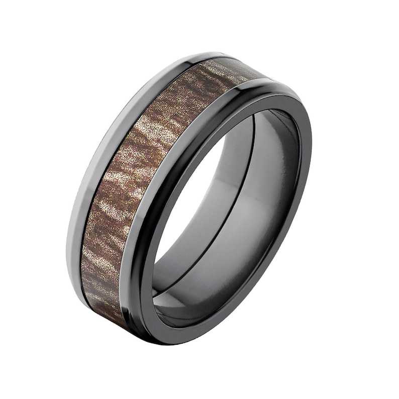 May include: A black ceramic wedding band with a brown wood inlay. The band has a beveled edge and a polished finish.