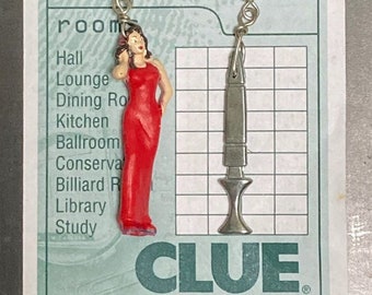 Clue token earrings #2. Sultry Miss Scarlet and a Deadly Dagger Dangle Whimsically In This Set of Mis-matched Upcycled Game Piece Earrings