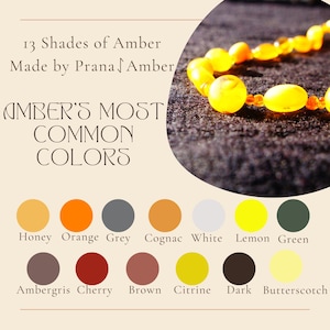 May include: A close-up of a necklace made of amber beads in various shades of yellow and orange. The image includes a color palette showing 13 shades of amber, with text that reads "13 Shades of Amber Made by Prana Amber".