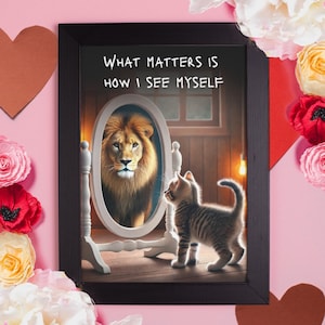 May include: A framed print with the text "WHAT MATTERS IS HOW I SEE MYSELF." The image depicts a kitten looking in a mirror and seeing a lion. The mirror is white, and the frame is black. The background is a soft pink.