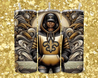 May include: A stainless steel tumbler with a gold and black design featuring a woman wearing a hoodie with a fleur-de-lis logo. The background is a swirling pattern of gold and black.