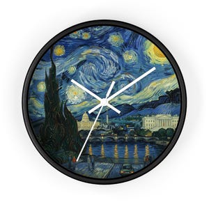 May include: Round wall clock with a black frame featuring a starry night design with a cityscape. The clock face has white hands and a depiction of a night scene with swirling blue and yellow colors.