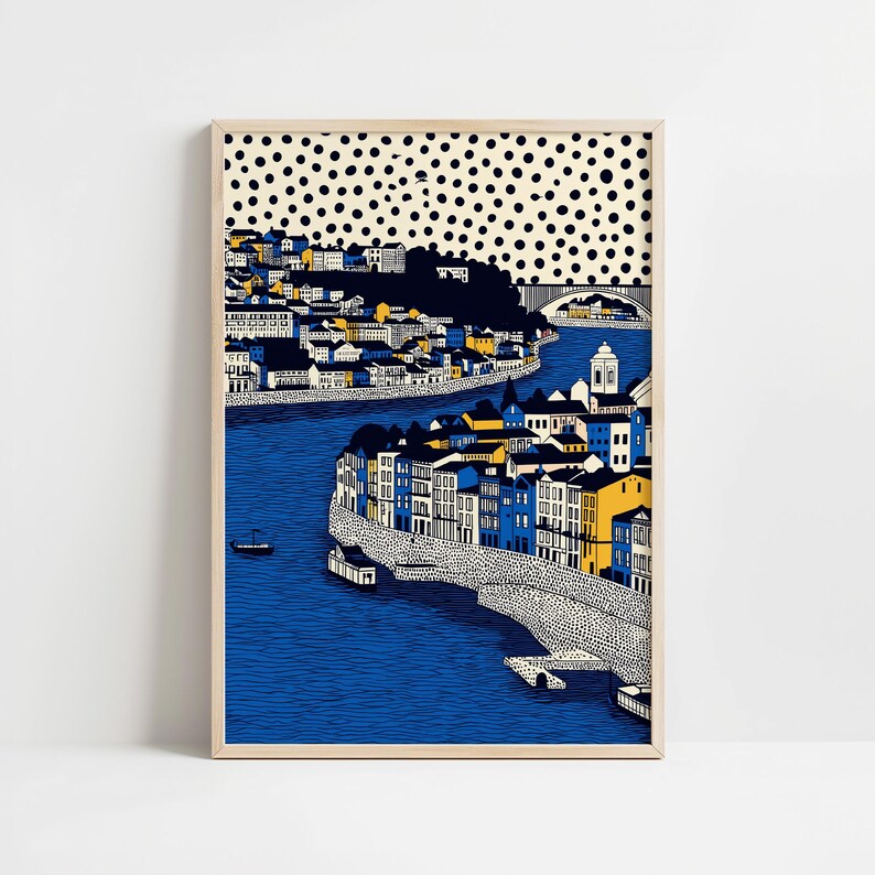K&ouml;nnte beinhalten: Gerahmter Kunstdruck mit einer farbenfrohen Stadtlandschaft und einem Fluss. Die Geb&auml;ude sind in Blau, Gelb und Wei&szlig; gehalten, mit einem gepunkteten Muster oben. Eine Br&uuml;cke &uuml;berspannt den Fluss.