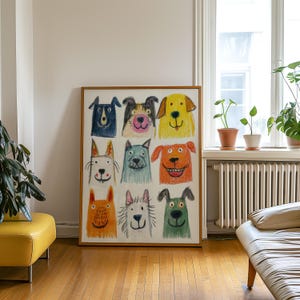 May include: A framed artwork featuring a colorful, whimsical illustration of nine different dog faces. Each dog is drawn with crayon-like strokes, showcasing a variety of colors and expressions. The artwork is displayed in a room with natural light.