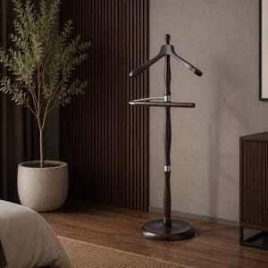 May include: A dark brown wooden valet stand featuring a contoured coat hanger at the top, a horizontal bar for trousers, and a central vertical post supported by a circular base, accented with silver-toned metal connectors between the wooden sections.