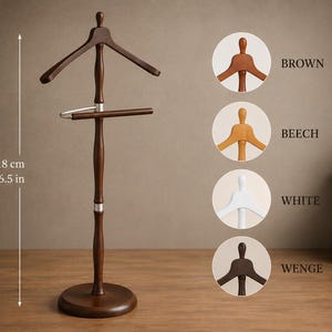 May include: A dark brown wooden valet stand with a coat hanger top and a horizontal trouser bar. The stand measures 46.5 inches in height. Four circular color swatches are displayed on the right, labeled Brown, Beech, White, and Wenge.