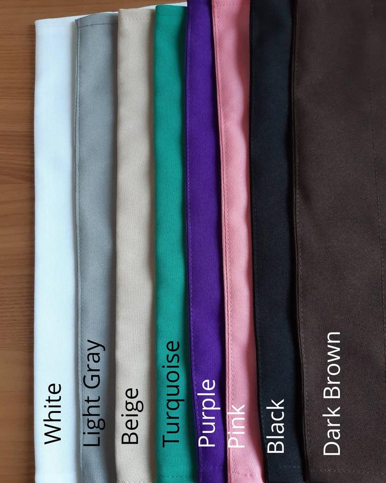 May include: A vertical display of fabric swatches in various colors, including white, light gray, beige, turquoise, purple, pink, black, and dark brown. Each swatch is labeled with its corresponding color name in white text.