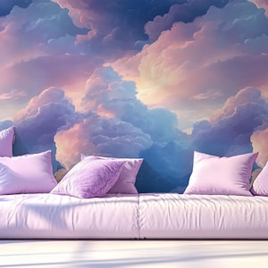 Puede incluir: Un sofá mullido de color lila claro con varias almohadas se encuentra frente a un mural de pared que representa un cielo de ensueño, colorido, con nubes esponjosas.