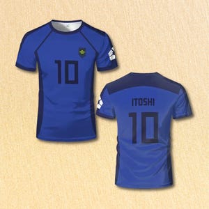 May include: Two blue soccer jerseys. The front jersey has the number 10 in black and a small emblem. The back jersey has the name "ITOSHI" and the number 10 in black. The jerseys have white accents on the sleeves.