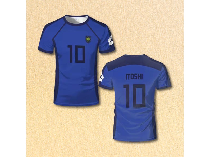 May include: Two blue soccer jerseys. The front jersey has the number 10 in black and a small emblem. The back jersey has the name "ITOSHI" and the number 10 in black. The jerseys have white accents on the sleeves.