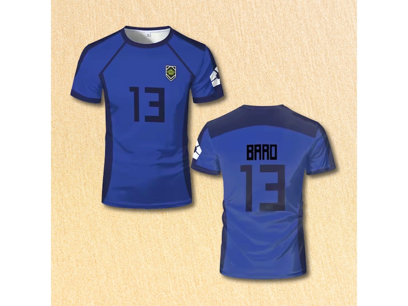 May include: Blue soccer jersey with the number 13 in black on the front and back. The front of the jersey also has the number 13 and the name "BARO" on the back. The jersey has a small emblem on the chest.