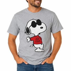 May include: A heather gray short-sleeve t-shirt featuring a graphic of the cartoon character Snoopy wearing black sunglasses and a red shirt with the text JOE COOL printed in black. The character is depicted in a standing pose.