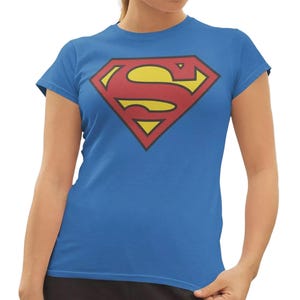 May include: A blue t-shirt with the Superman logo. The logo is a red and yellow diamond shape with a red "S" in the centre. The shirt is short-sleeved and made of a soft material.