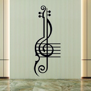 Pu&ograve; includere: Adesivo da parete nero e bianco con chiave di violino e pentagramma. La chiave di violino &egrave; stilizzata con un fiocco decorativo in alto e in basso.