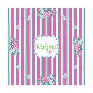 May include: A square textile with a pink and teal striped design. The word "Mahjong" is in a white, scalloped frame. Floral bouquets and Mahjong tiles are scattered across the surface.