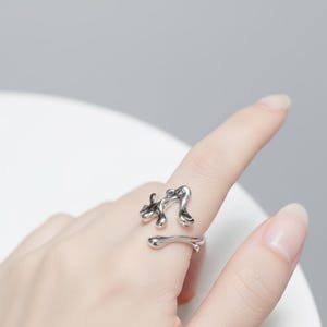 Modern Flowing Abstract Ring – Adjustable Metal Art Design