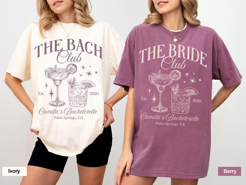 May include: Two oversized t-shirts with a bachelorette party theme. The ivory shirt says "The Bach Club" and the berry shirt says "The Bride Club". Both shirts feature a cocktail glass and a glass of ice with the text "Camila's Bachelorette, Palm Springs, CA" and "Est. 2025".