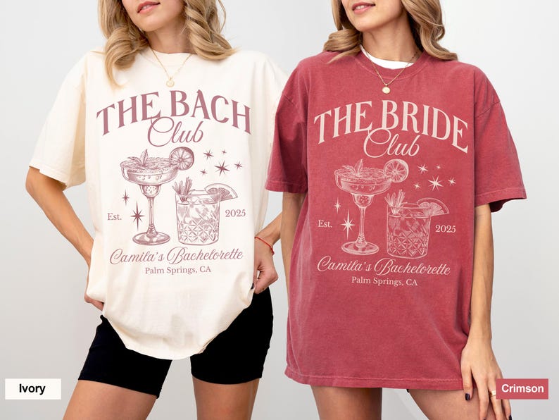 May include: Two t-shirts, one ivory and one crimson, with a bachelorette party design. The shirts feature the text "The Bach Club" and "The Bride Club" with a cocktail illustration and the text "Camila's Bachelorette, Palm Springs, CA, Est. 2025".