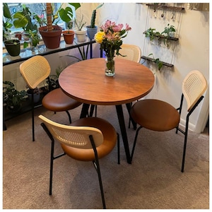 May include: A set of three ceramic mugs with a speckled, matte finish. The mugs are in shades of cream, light gray, and dark gray. Each mug has a simple, minimalist design, perfect for coffee or tea.