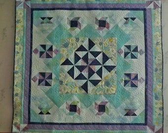 Quilted wall hanging purple and blue pinwheels