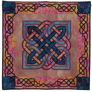 May include: A colorful quilt with a Celtic knot design in shades of blue, purple, and orange. The knot is surrounded by a black border with a repeating knot pattern.