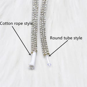 May include: Close-up of two decorative rhinestone cords. One is a cotton rope style, and the other is a round tube style. The cords are covered in small, sparkling rhinestones. The text in the image reads "Cotton rope style" and "Round tube style".