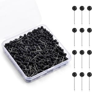 May include: A clear plastic container filled with numerous black ball-headed push pins. Several push pins are displayed separately. The pins have silver shafts and are suitable for various office, craft, or home projects.