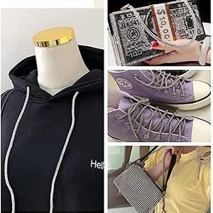 May include: A black hoodie with white drawstrings and the word "Hello" printed on the front. Also shown are a rhinestone-covered dollar bill clutch, purple sneakers with rhinestone laces, and a small black and white checkered purse.