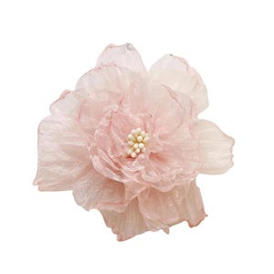 May include: A soft pink fabric flower with layered petals. The centre has a cluster of small, off-white beads. This decorative flower could be used as a hair accessory or to embellish clothing.