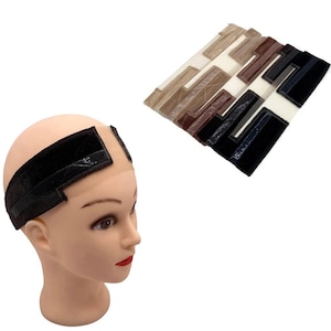 May include: A set of wig grip bands featuring a velvet-textured material with a hook-and-loop closure. The bands are available in various neutral shades including black, brown, beige, and white, displayed on a mannequin head and in a stack.