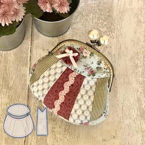 May include: A patchwork coin purse with a metal clasp and pearl-like accents. The purse features a floral pattern, striped fabric, and a central burgundy panel with pink lace trim. A small pink bow and fabric flower adorn the top.
