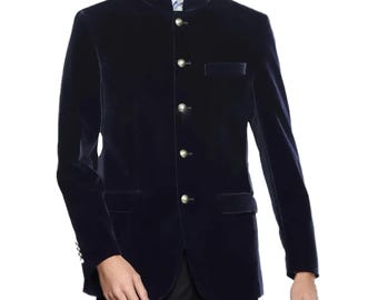 May include: A navy blue velvet jacket with a mandarin collar and gold-colored buttons. The jacket has a tailored fit, a chest pocket, and two side pockets. The sleeves are long and the jacket is buttoned up.