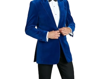May include: A vibrant blue velvet blazer with a classic notched lapel. The jacket is paired with a white dress shirt, a black bow tie, and black trousers. The blazer has a tailored fit and is buttoned at the front.